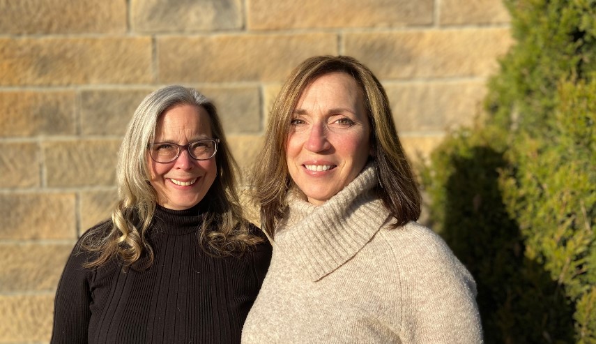 Dr Lynn Luna Jones and Dr. Archangela Wood pose for a picture together in front of their private practice.